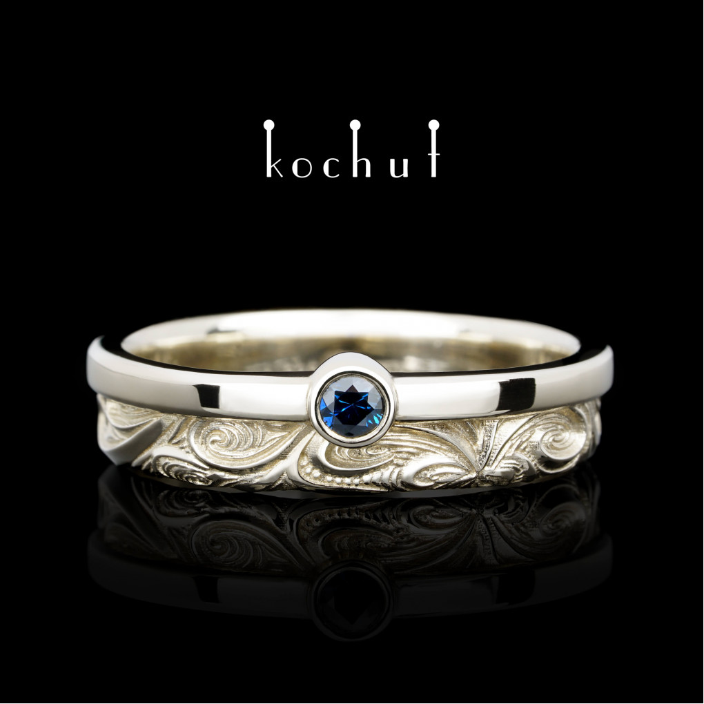 Wedding ring «In joy and sorrow: halves». White gold, sapphire