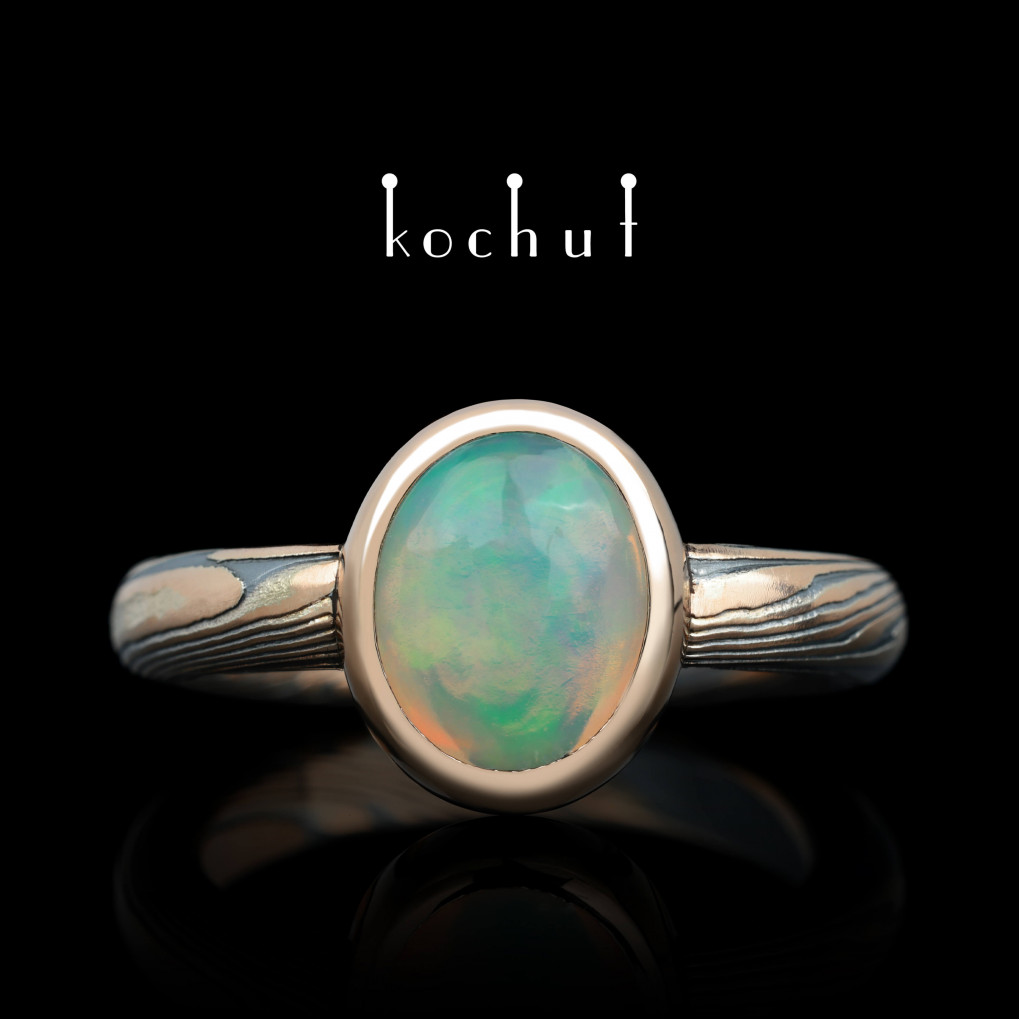 Ring mokume «Haiku». Red gold, etched silver, opal, oxidized