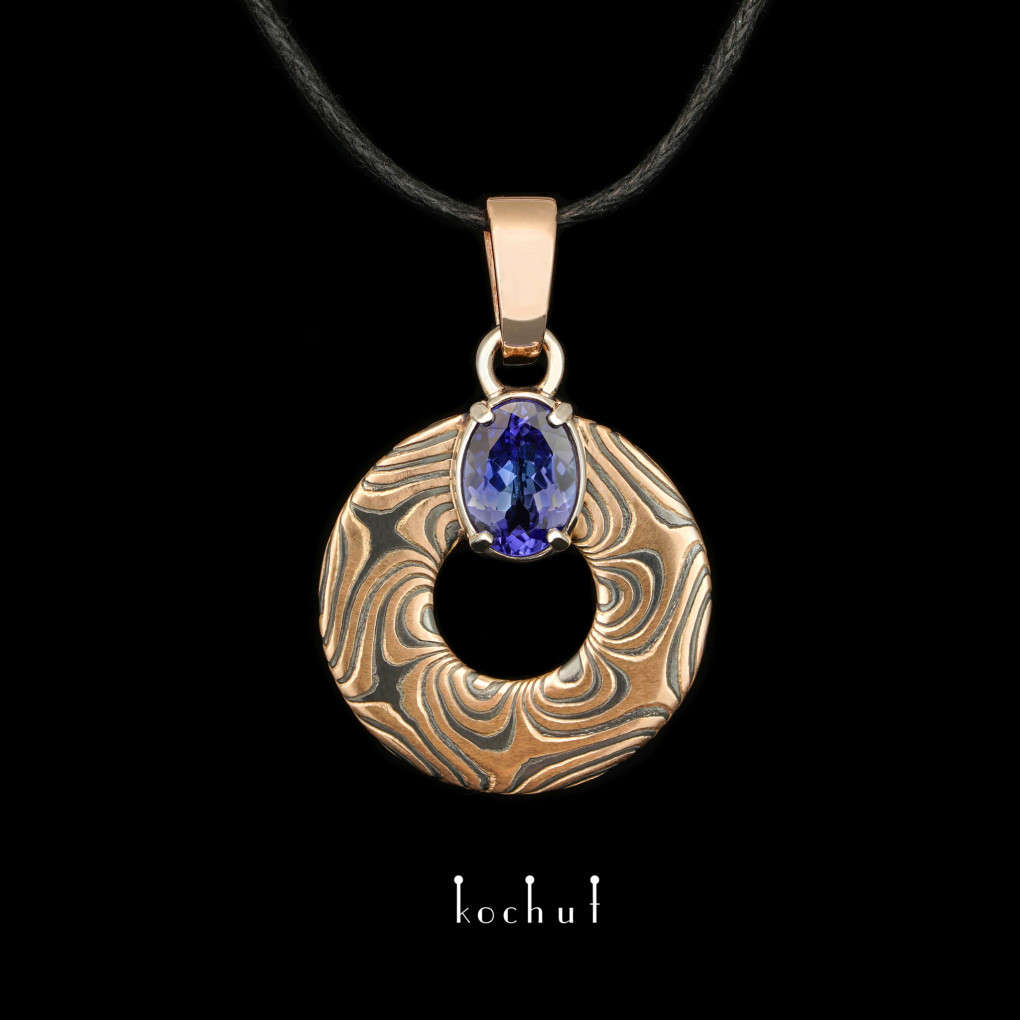 Mokume pendant «Precious astrolabe». Red and white gold, etched silver, tanzanite, oxidized