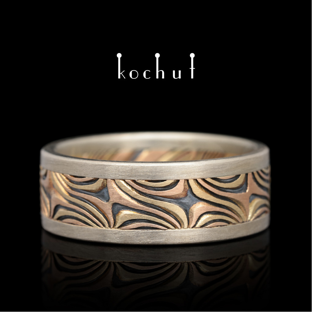 Mokume wedding ring "Shining of the Eastern Stars". White, yellow, red gold, etched silver, oxidation